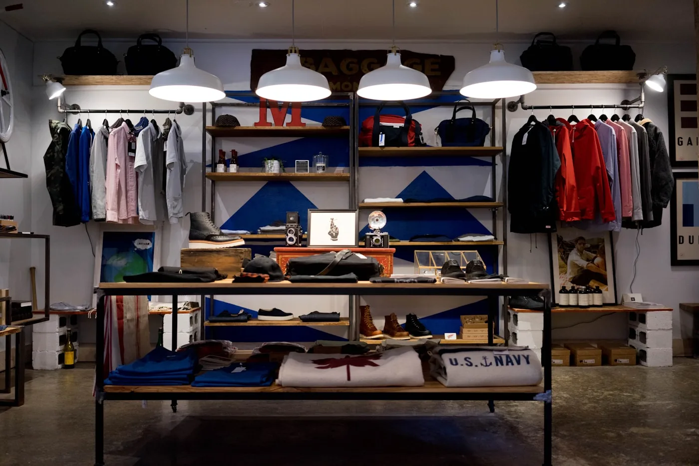 Clothing, shoes and cameras displayed in a small shop